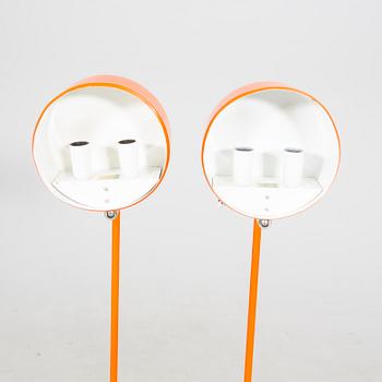 a pair of Anders Pehrson metal floor lamps from Ateljé Lyktan.