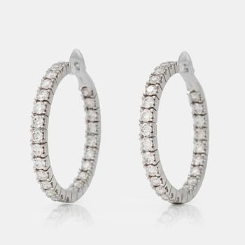 A pair of diamond earrings, 3.85 cts in total,according to engraving.