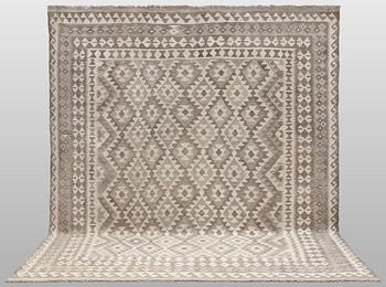 A Kilim rug, approx. 294 x 250 cm.