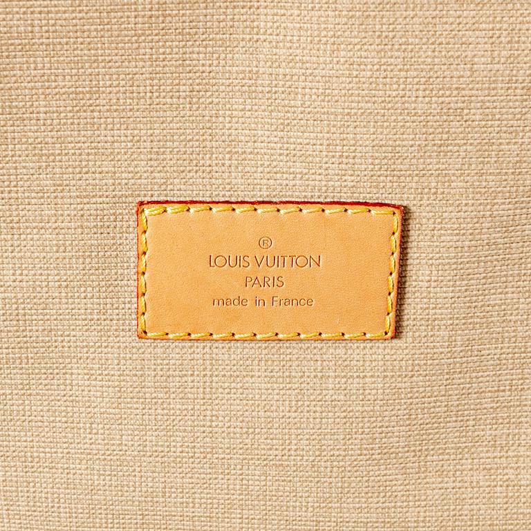 A Louis Vuitton travel bag.