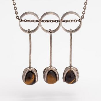 Elis Kauppi, A silver necklace with tiger's eye pearls. Kupittaan kulta, Turku 1965.