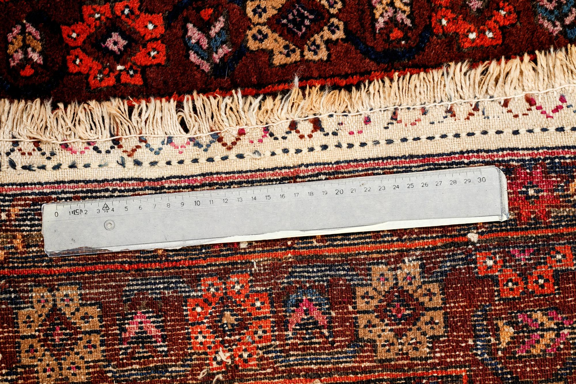 A SEMI ANTIQUE QUCHAN/KURDISH RUG, 248 x 134 cm.