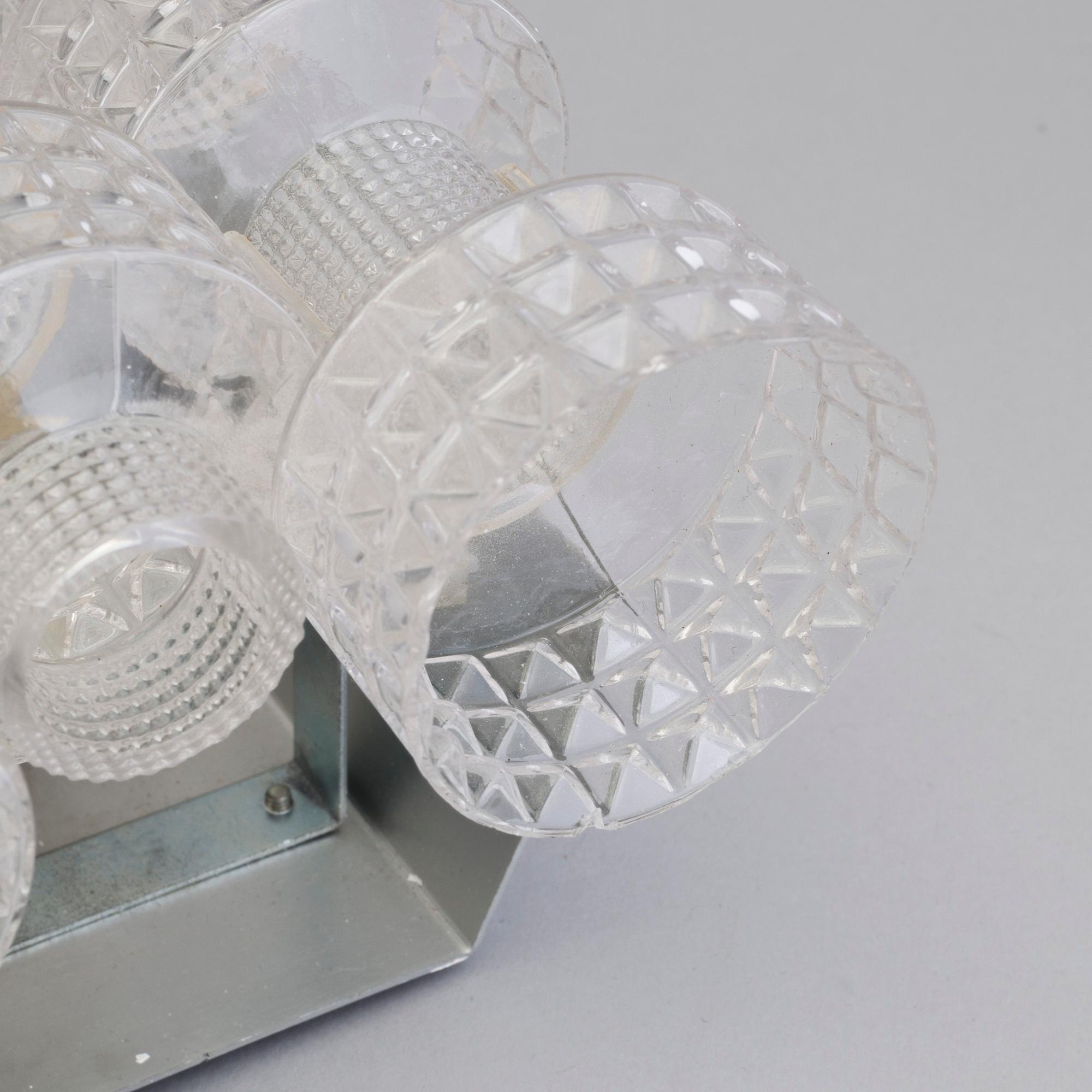 A pair of wall lamps by Gert Nyström for Fagerhult, second half of the 20th century.