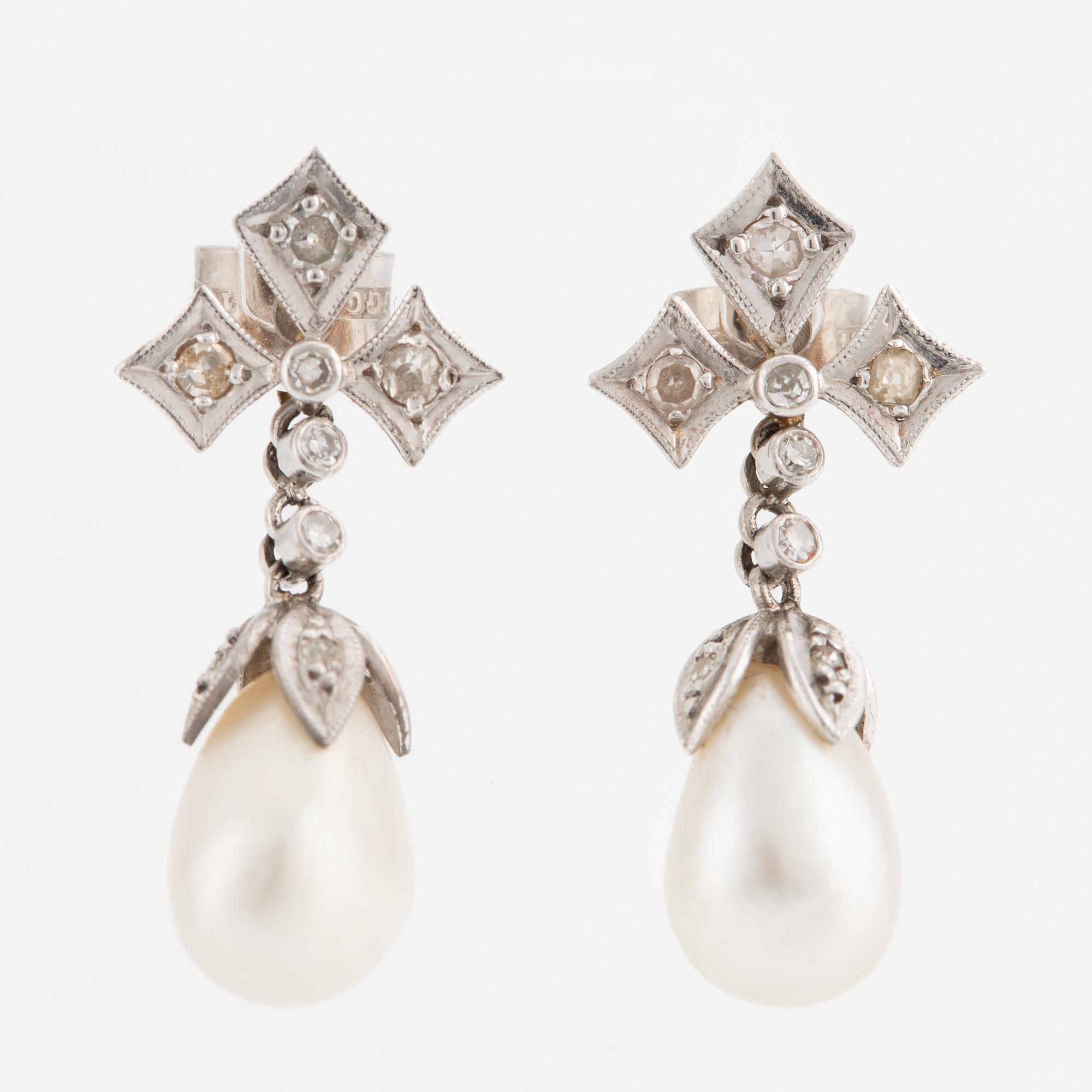 Earrings, a pair, gold, with drop-shaped pearls and small diamonds.
