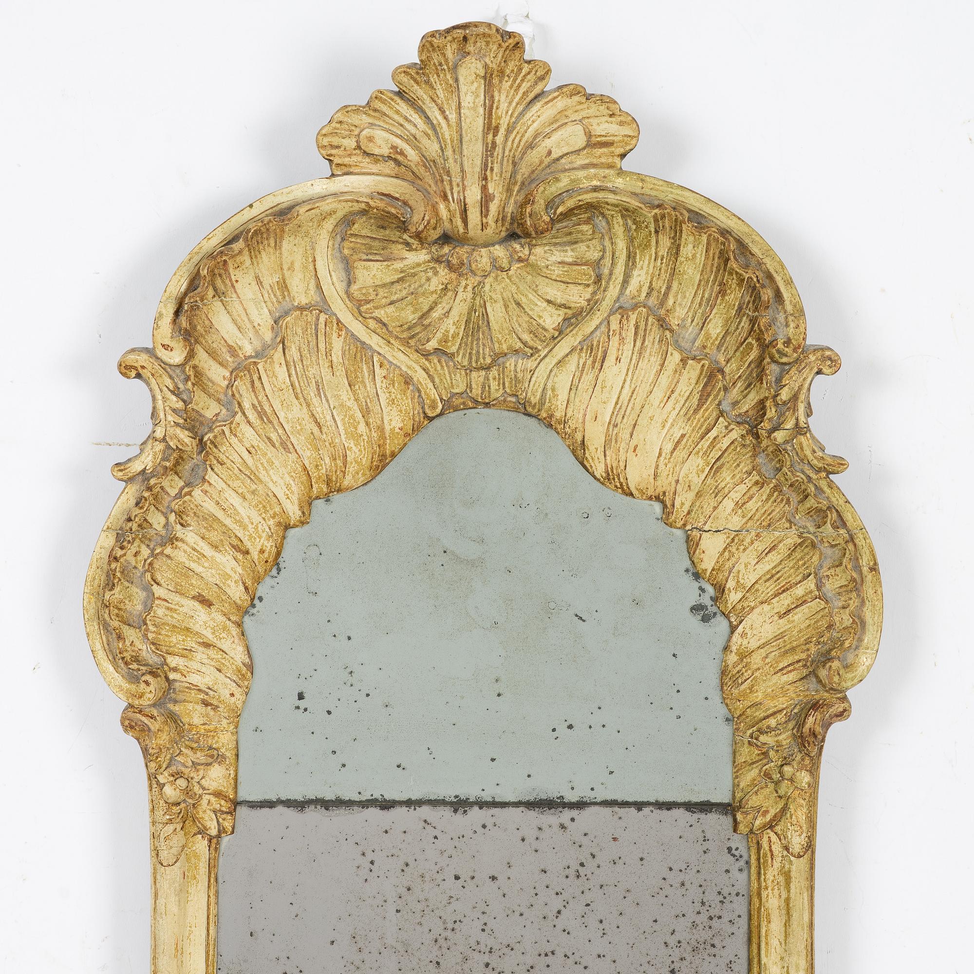 A giltwood rococo mirror, Stockholm, mid 18th century.