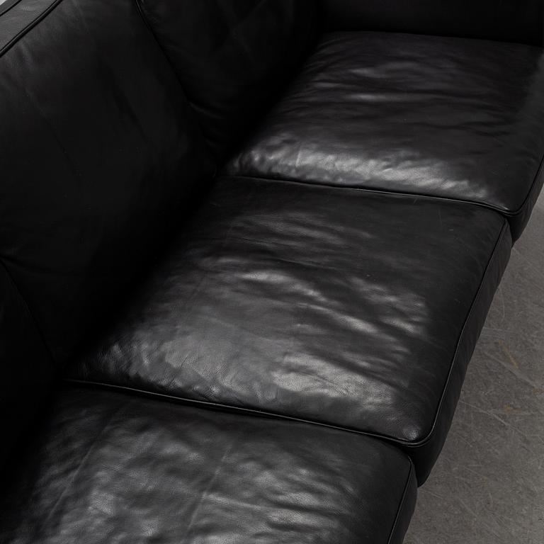 An 'AV59' sofa by Arne Vodder, Nielaus, Denmark.