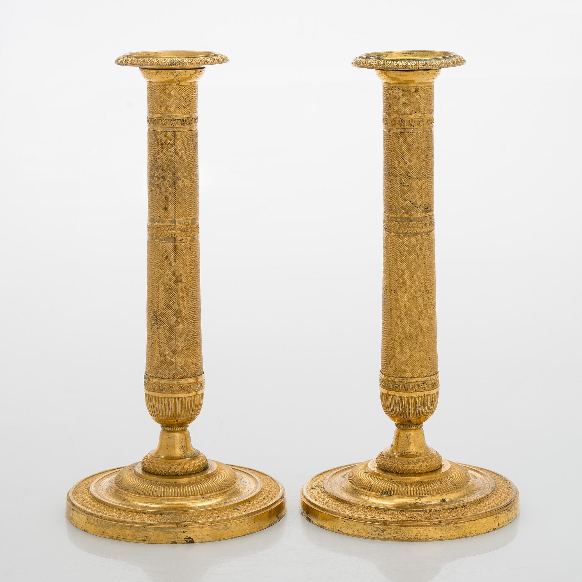 A pair of early 19th century French Empire candlesticks.
