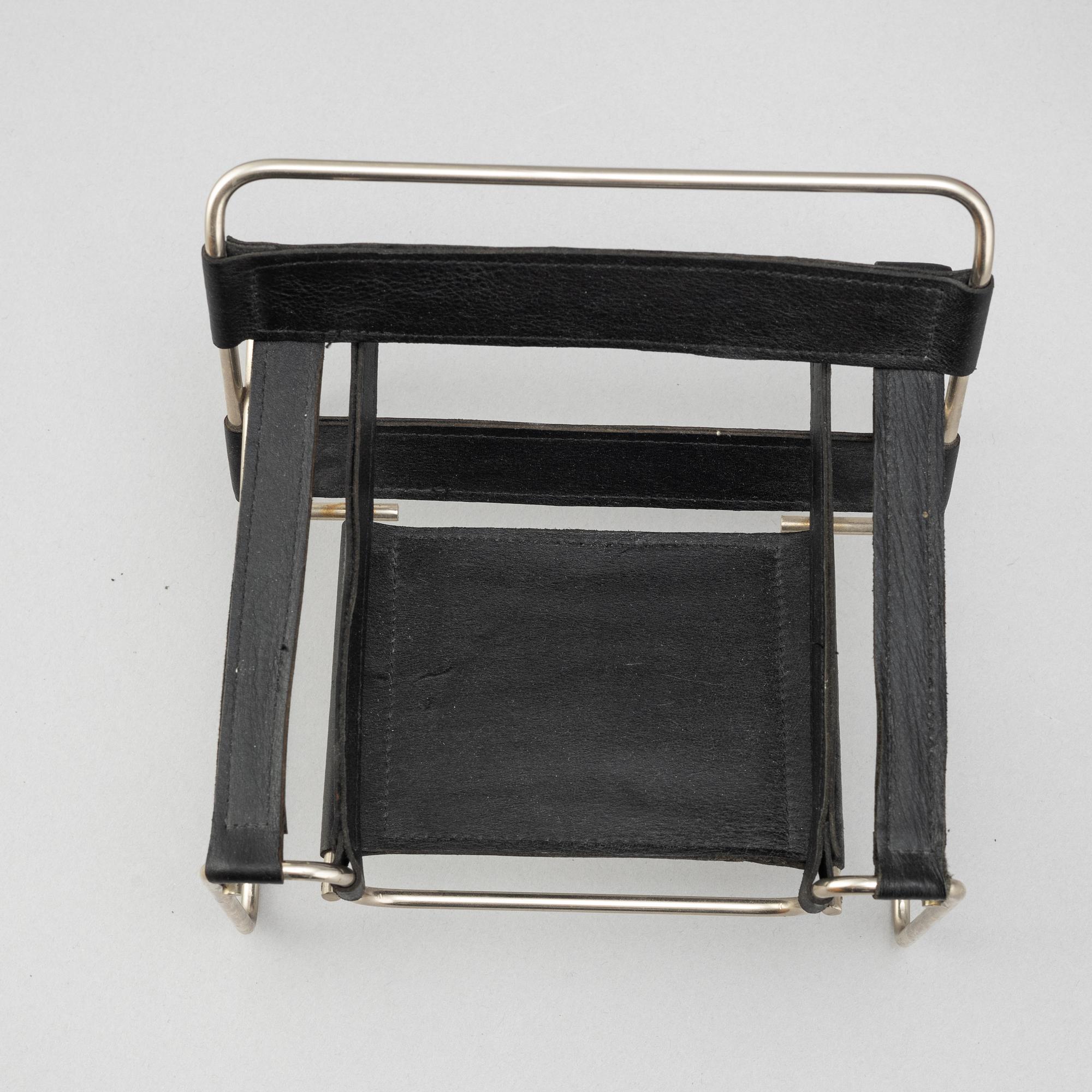 Miniatures of three famous design chairs, 21st century.