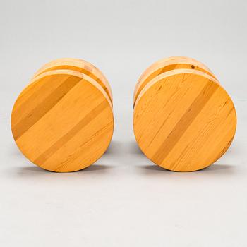 A pair of Finnish pinewood stools/ sidetables, late 20th century.