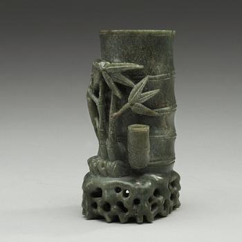 A green stone brush pot, China, 20th Century.