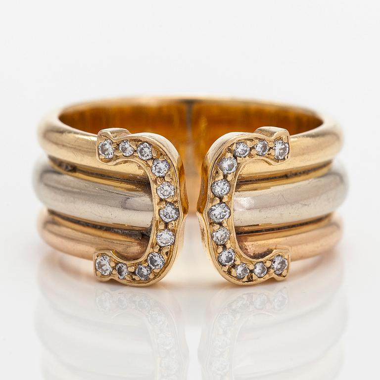 Cartier, ring "Double C" in 18K tri-coloured gold with round single-cut diamonds.