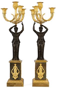 943. A pair of Empire four-light candelabra.