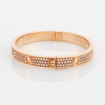 A Cartier bracelet "Love" in 18K rose gold set with round brilliant-cut diamonds.