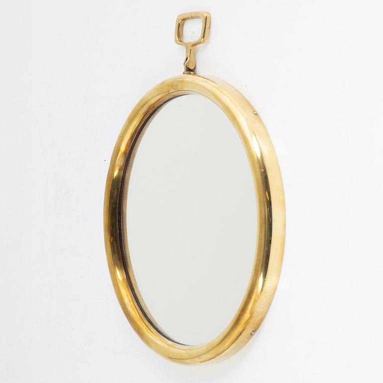 Josef Frank or Estrid Ericson, a model "H2672" brass mirror,Firma Svenskt Tenn, 1950's/60's.