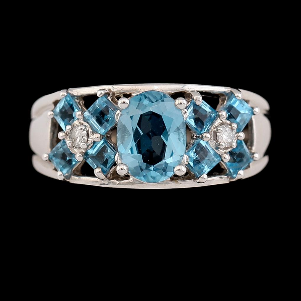 RING, 14K vitguld, turkosblå topaser samt diamanter.