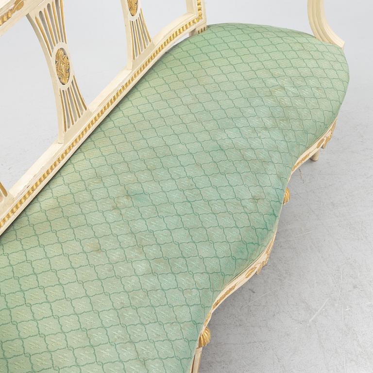 A painted and carved Gustavian style sofa, 1920's.
