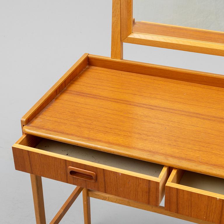 A teak make-up table from the second half of the 20th-century.