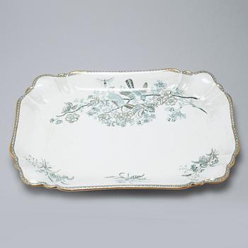 A earthenware table set of 136 pcs "Vexiö Guld",  by Arvid Ekberg, Gustafsberg, from around year 1900.