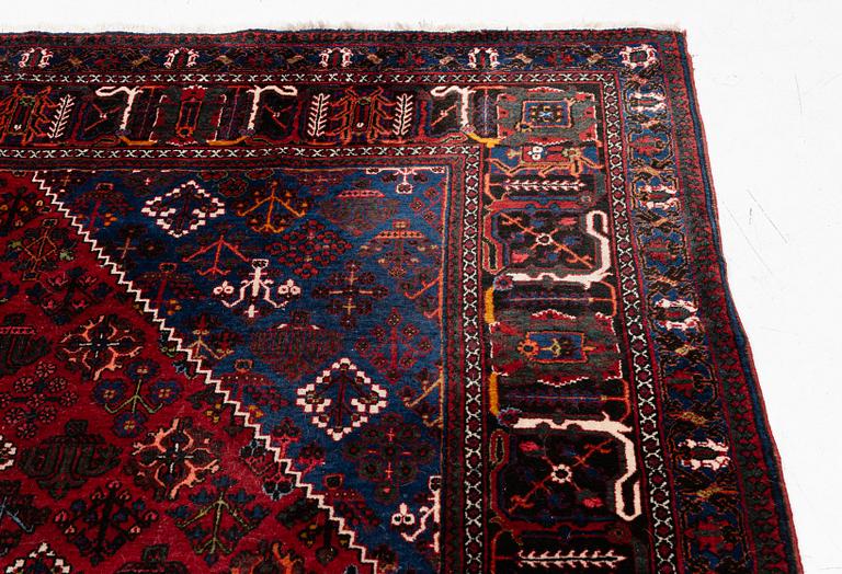 An oriental rug, c. 365 x 285 cm.