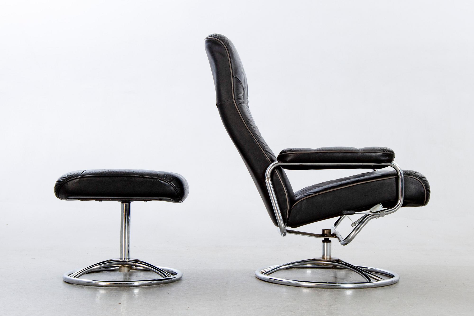 A leather swivel armchair and stool, Söderbergs  1980s.