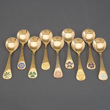 A collection of 23 gold plated sterling silver year/Christmas spoons, Georg Jensen, Copenhagen Denmark, 1972-1986.