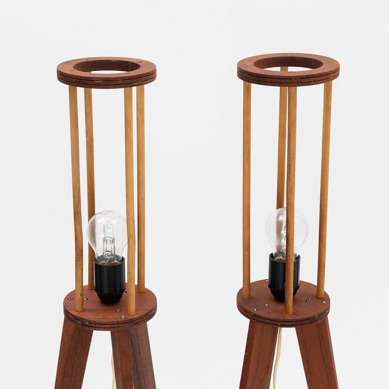 A pair of teak floor lamps, mid 20th Century.