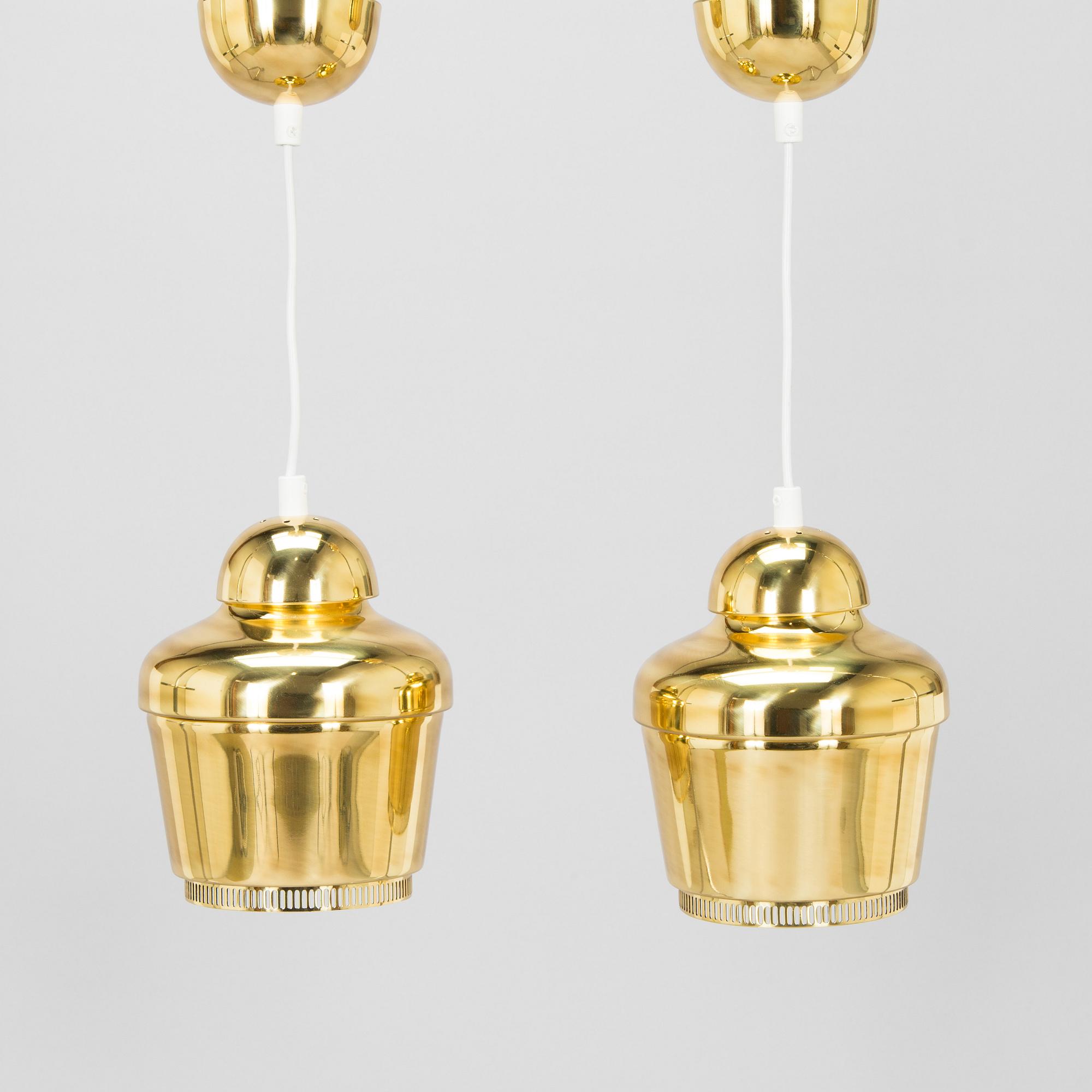 Alvar Aalto, A pair of  A 330, 'Golden Bell' pendant lights A330 for Artek, 2000s.