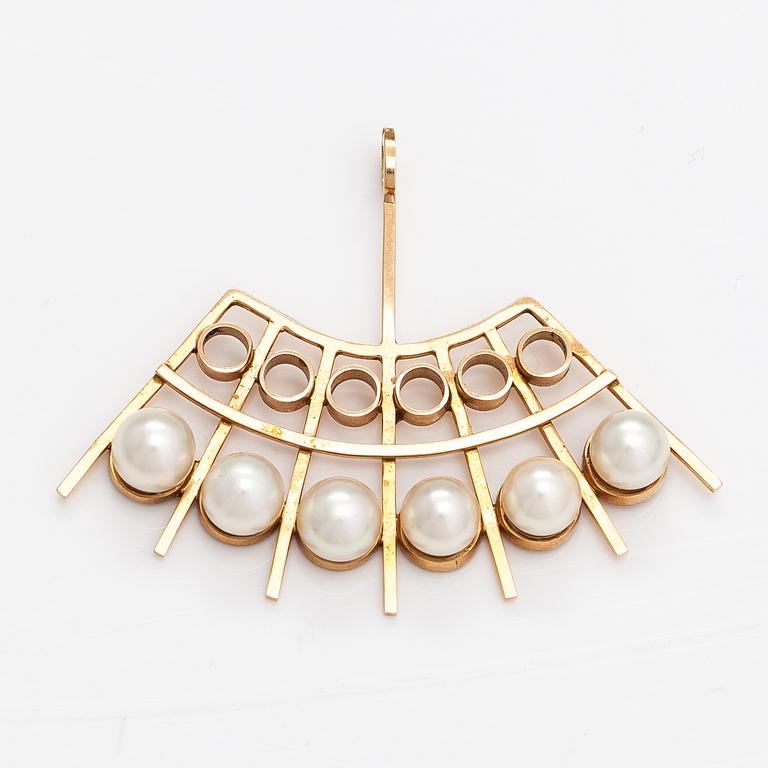 A 14K gold pendant with cultured pearls. Helsinki 1964.