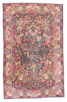 304. A rug, semi-antique Kerman, ca 218 x 140,5 cm.