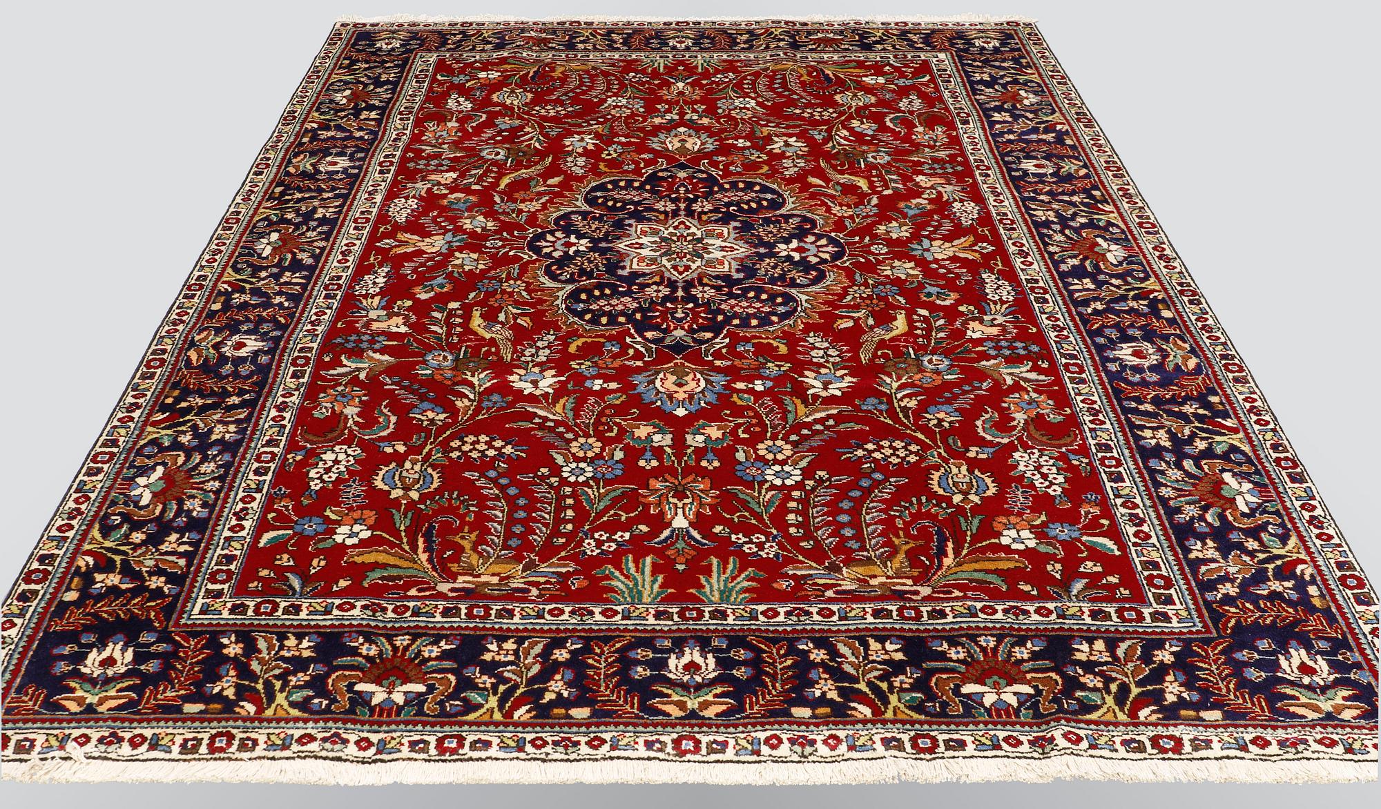 A carpet, Figural Tabriz, ca 310 x 220 cm.
