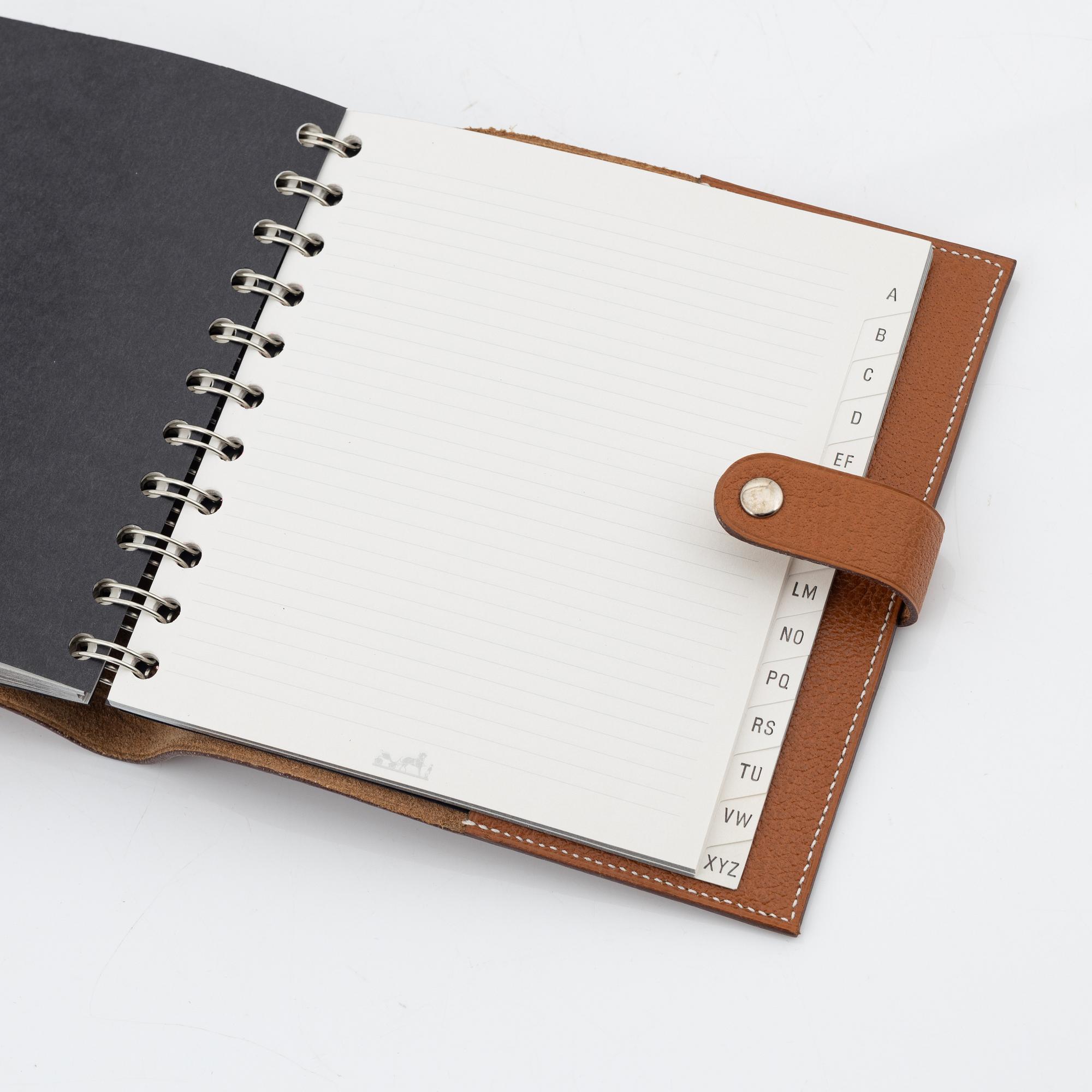 Hermès, a whisky leather notebook/agenda.