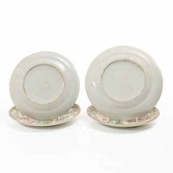 A matched set of 14 famille rose 'Canton' dinner plates, Qing dynasty, 19th century.