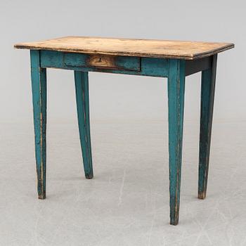 A 19th century table with a drawer.