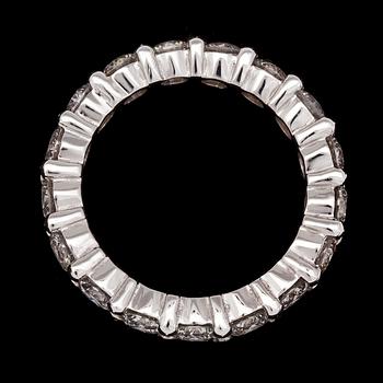 A brilliant cut diamond eternity ring, tot. 3.40 cts.