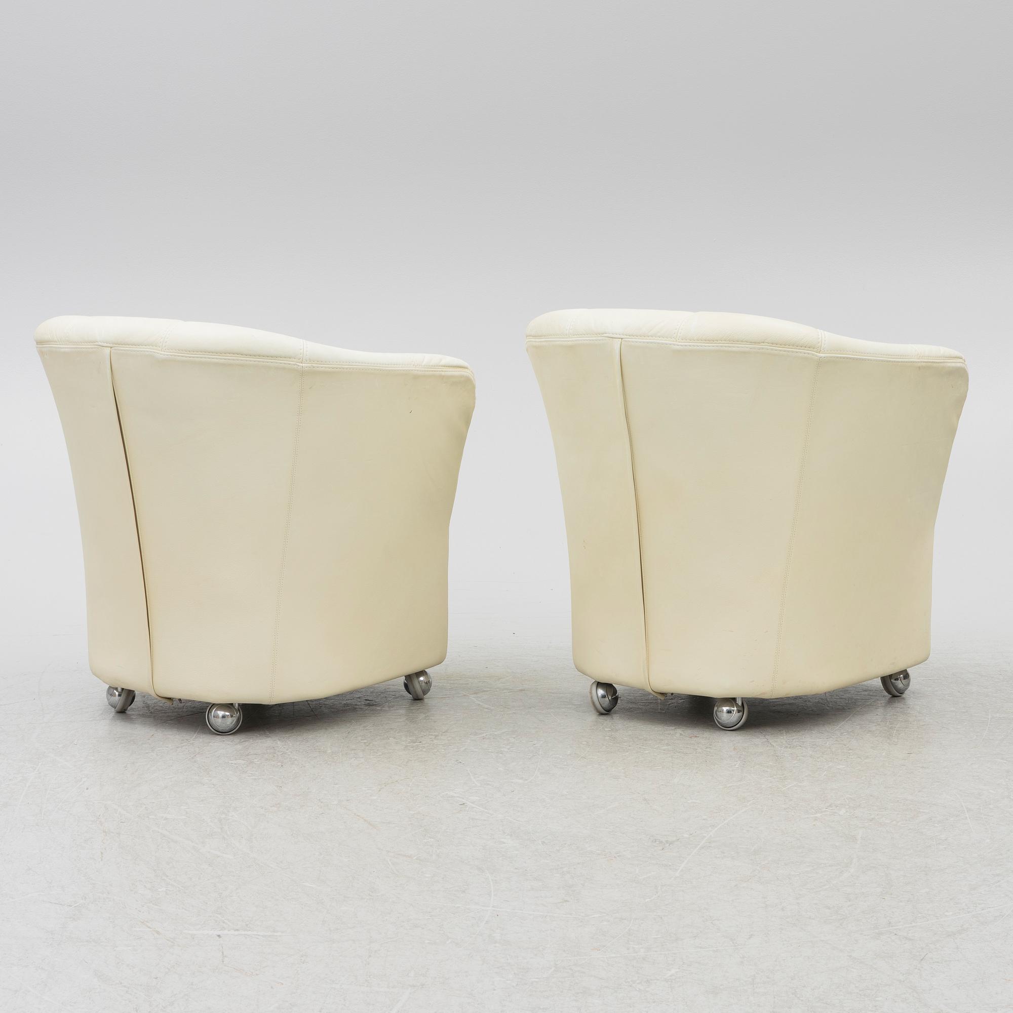 A pair of leather armchairs, Dux, Sweden, 1980's.