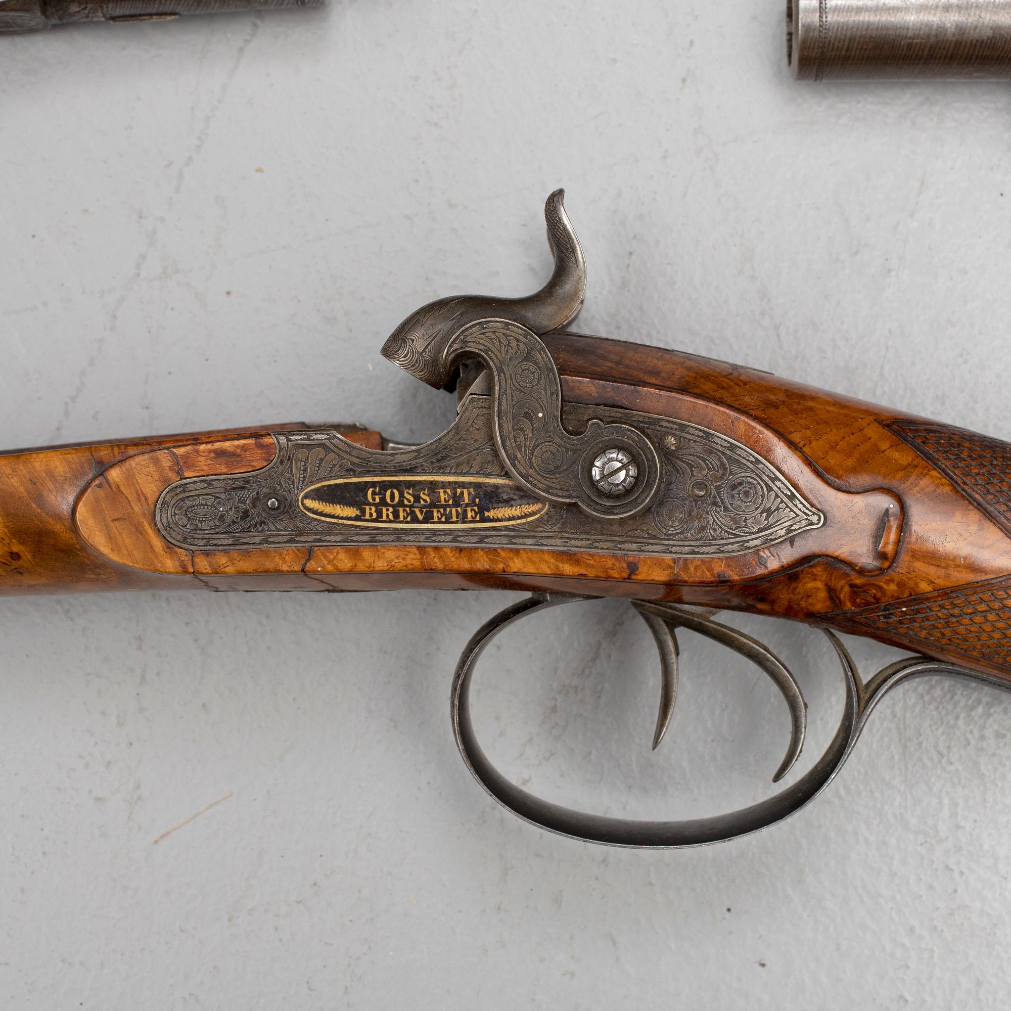 A cased double barreled percussion shotgun marked Gosset a Paris and a pair of percussion pistols marked Fni PAR LEPAGE.