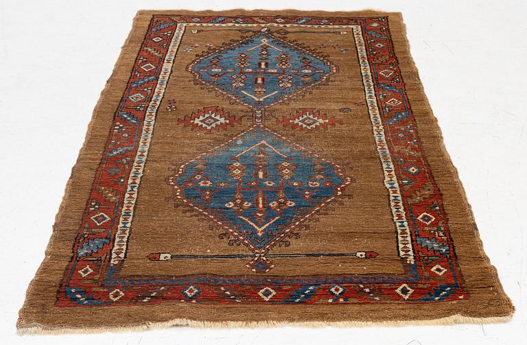 An antique Sarab rug, northwestern Iran, c. 213 x 107 cm.