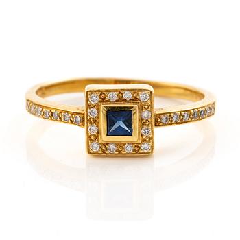 18K gold ring with a sapphire and brilliant-cut diamonds.