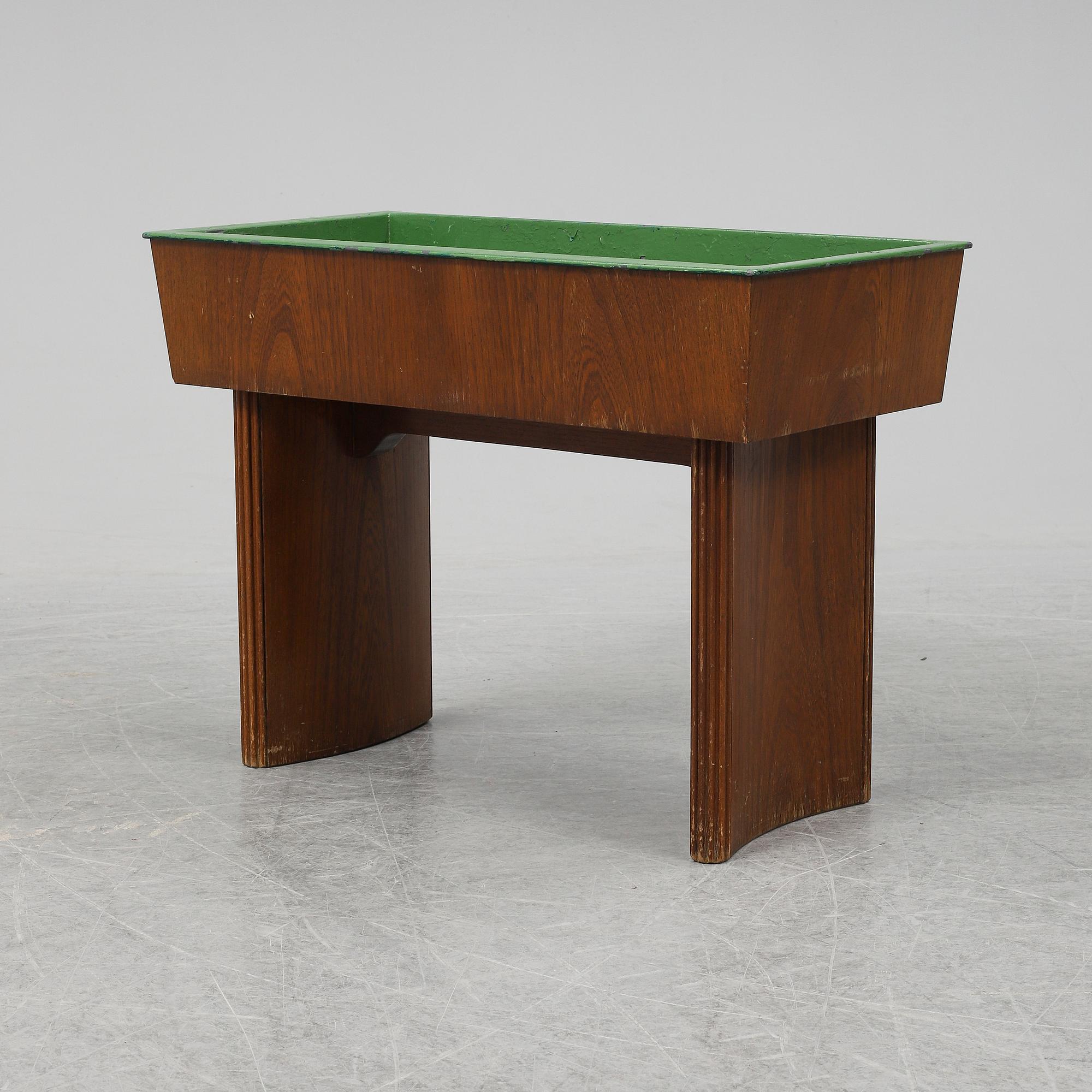 NORDISKA KOMPANIET, possibly be Carl Axel Acking, an oak plant stand from 1942.