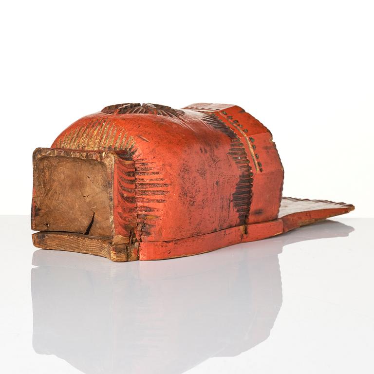 A Swedish folk art carved and painted spoon holder, 18th century.