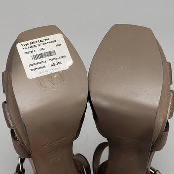 YVES SAINT LAURENT, a pair of open toe patent leather shoes, size 37½.