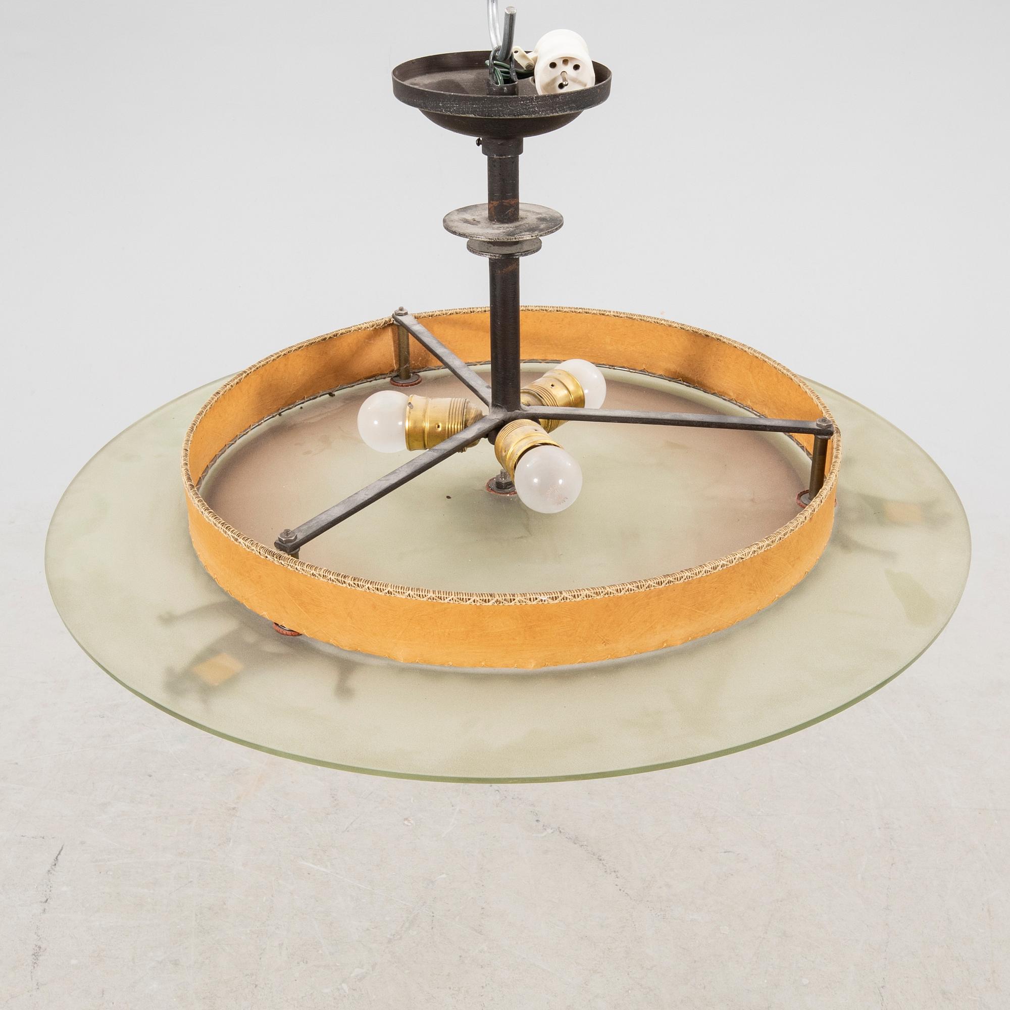 A 1930s glass ceiling pendant.