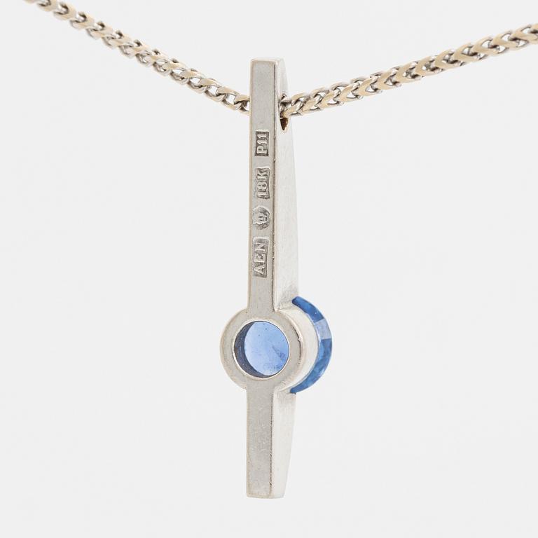 An 18K white gold necklace with a faceted sapphire.