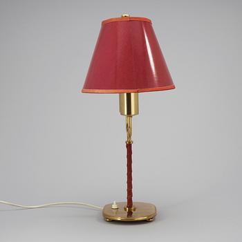 A Josef Frank brass and red leather table lamp by Svenskt Tenn.