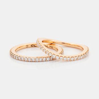 421. Ole Lynggaard två ringar "Love" 18K guld med runda briljantslipade diamanter.