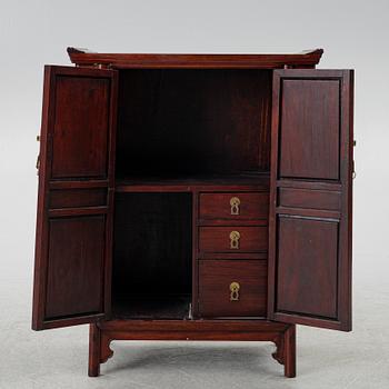 A small Chinese wooden cabinet, 1900s.