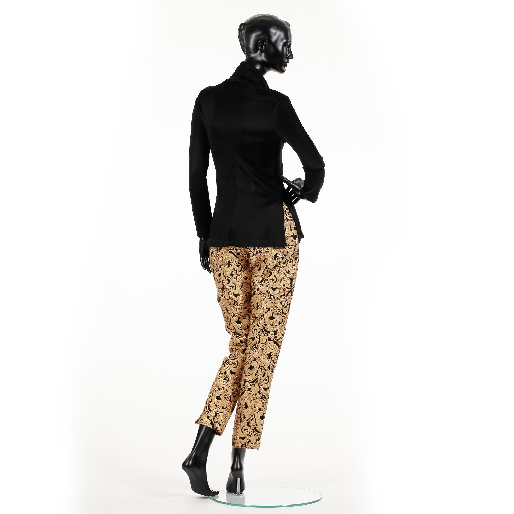 OZBEK, a polo-neck sweater and trousers.