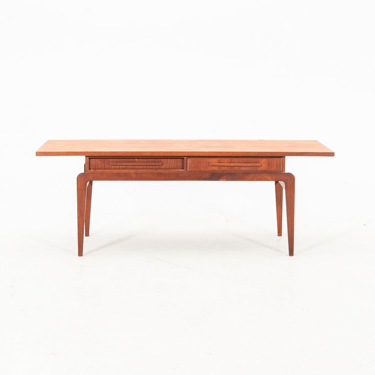 A teak coffee table from the middle of the 20th century.