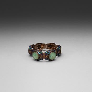 72. A silver, enamel and nephrite bracelet, late Qing dynasty.