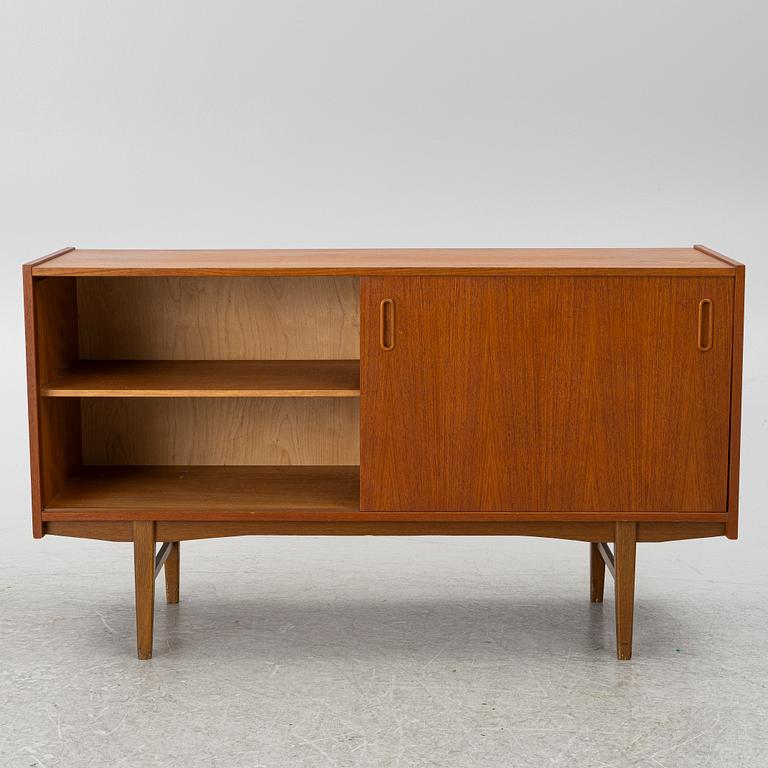 A 1950's teak veneered sideboard.